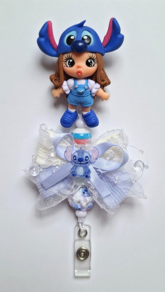 Clay badge reel girl with Blue guy .